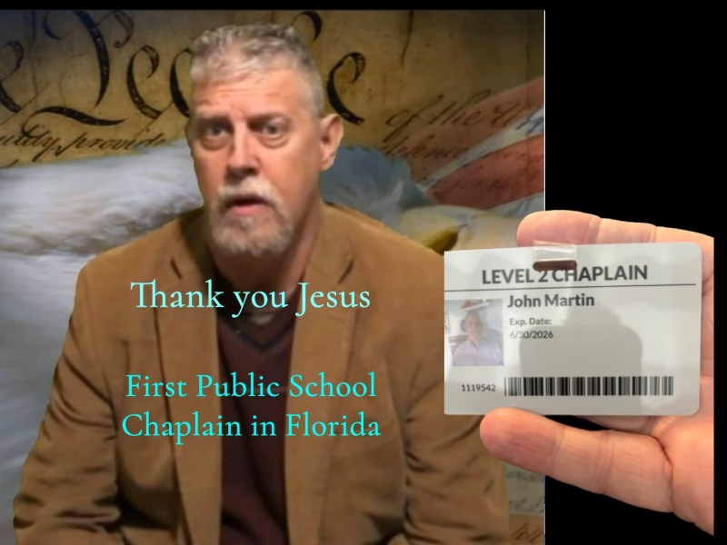 Man with a beard and a brown jacket over a blurred background of a parchment document. Overlaid text reads: 'Thank you Jesus First Public School Chaplain in Florida'. A hand holds an ID card identifying 'John Martin' as a 'LEVEL 2 CHAPLAIN' with an expiration date of '6/30/2026'.